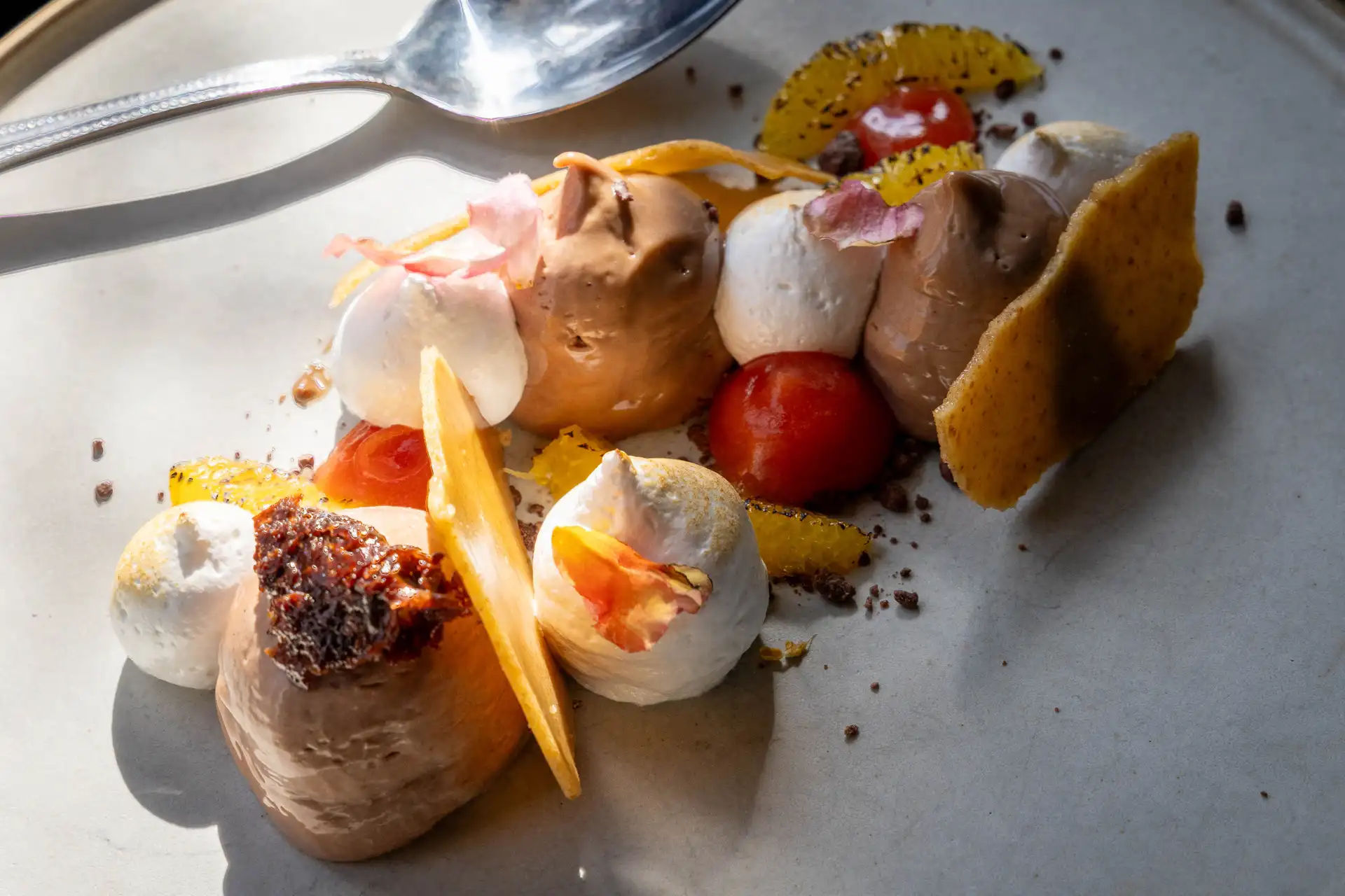 Rich chocolate & Seville orange cheesecake Rich chocolate & Seville orange cheesecake with blood orange fluid gel, toasted marshmallow and orange tuile
